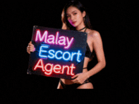 Woman holding sign reading "Malay Escort Agent